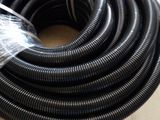 a black hose that has been wrapped up on a table