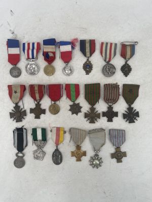 several medals and medals are arranged on a white surface