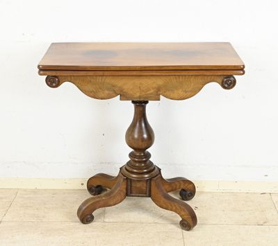 an image of a small table with a wooden top on a tile floor
