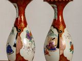 two vases that are sitting on a table