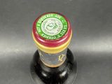 a close up of a bottle of beer on a table
