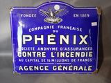 an old blue sign advertising phenix in french on a white background