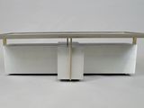 a surfboard sitting on top of a white table