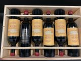six bottles of wine in a wooden box