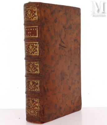 an old book sitting on top of a table next to a white background