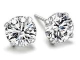 a pair of diamond stud earrings on a white background
