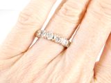 an image of a woman ' s hand with a diamond ring on it