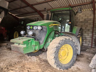 a tractor that is parked in a garage
