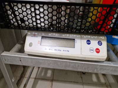 an image of a scale on a shelf in a kitchen