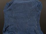 the back of a denim jacket on a mannequin base