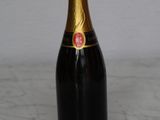 a bottle of champagne sitting on a counter top