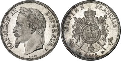 a close up of a coin with a man ' s face on it