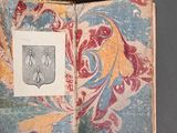 a picture of a book with a picture of a coat of arms on it