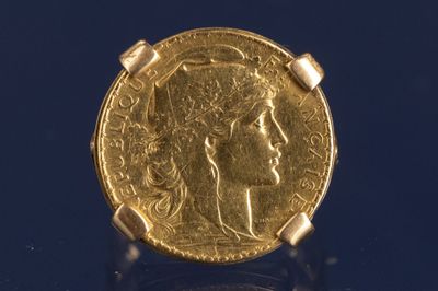 l'image d'une pièce d'or sur laquelle figure le visage d'une femme
