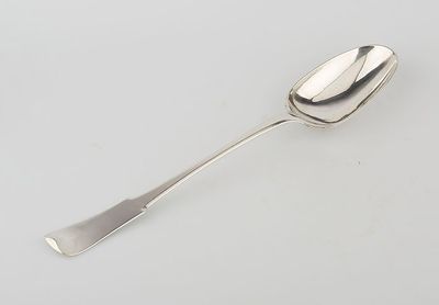 silver spoon on a white table with a white background
