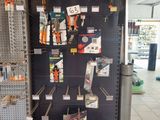 a large display of tools on the wall in a store
