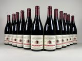 six bouteilles de vin rouge alignées