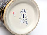 a close up of a cup with a picture of a castle on it