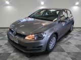 a picture of a silver volkswagen golf in a showroom
