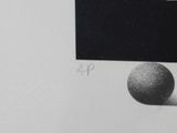 a black and white drawing of a ball and a black box