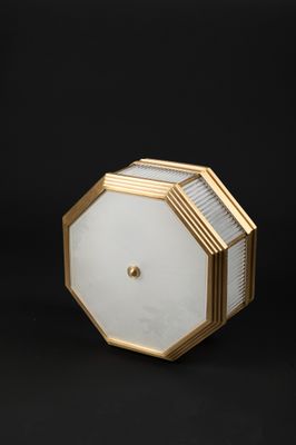a close up of a light fixture on a black background