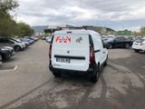 a white van that is parked in a parking lot