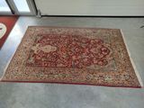 an image of a red rug on the floor in a room