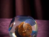 a glass bowl with some rocks in it on a table