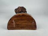 a close up of a statue of a dog on a wooden base