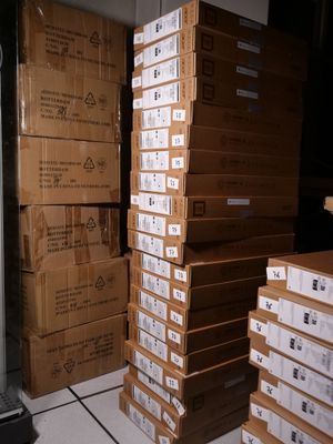 many boxes stacked on top of each other in a room