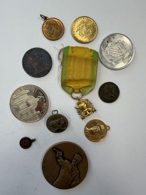 a small collection of medals and medals on a table
