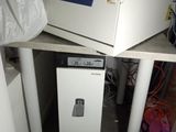 a picture of a kitchen with a microwave and a trash can