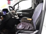 a picture of a car with a bag of luggage in the passenger seat