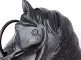 a statue of a horse with a ring in it ' s mouth