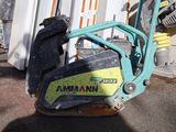 a small machine that is sitting outside of a building