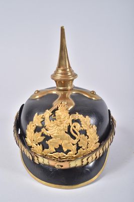 a black and gold helmet with gold decorations on it