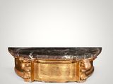 a gold and black marble coffee table on a white background