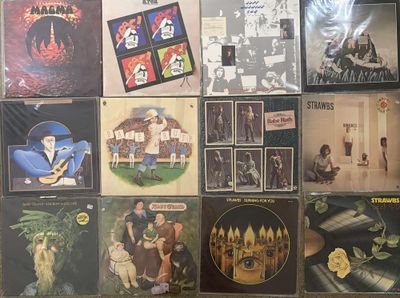 a lot of records on the wall of a room