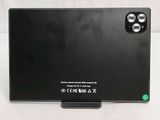 the back of a black laptop computer sitting on top of a white surface