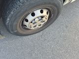 a close up view of a flat tire on a truck