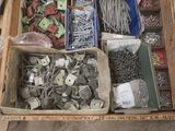 many different types of screws and nails in a box