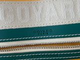 a close up of a green and white purse with a zipper