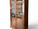 an image of a wooden cabinet with glass doors