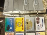 a suitcase full of cds sitting on a table