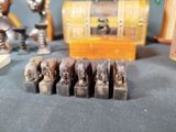 a lot of wooden elephant figurines sitting on a table