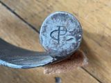 a close up of a hammer with a dollar sign on it