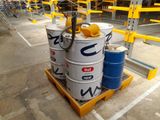 a pallet with several barrels on it in a warehouse