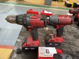 two red power tools on a table with a price tag on it