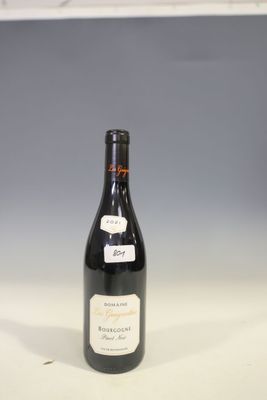 a bottle of wine that is sitting on a table