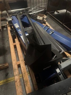 a boat that is sitting on a pallet in a warehouse